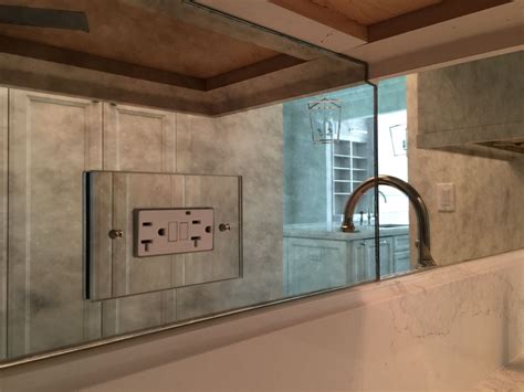 electrical outlet wall covered by mirror